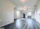 Spacious bonus room with hardwood floors, ceiling fan, natural light, and closet storage at 238 Marks Rd, Mansfield, GA 30055