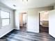 Bonus room with hardwood floors, natural light, and multiple doorways offers versatile possibilities at 238 Marks Rd, Mansfield, GA 30055