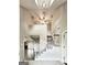Grand foyer with soaring ceilings, showcasing a staircase with white railings and a view into adjacent living spaces at 238 Marks Rd, Mansfield, GA 30055
