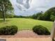 Expansive front yard view from the porch steps, showcasing the vast green space and mature trees at 238 Marks Rd, Mansfield, GA 30055