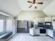 Bright kitchen features white cabinets, tile flooring and backsplash, with eat-in area near bay window at 238 Marks Rd, Mansfield, GA 30055