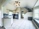 Bright eat-in kitchen with stainless steel refrigerator and a pass-through to the staircase and upstairs area at 238 Marks Rd, Mansfield, GA 30055