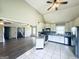 Open concept kitchen with stainless steel appliances, white cabinets, and easy access to the living area at 238 Marks Rd, Mansfield, GA 30055