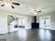 Spacious living room with hardwood floors, fireplace, and French doors leading to the outside at 238 Marks Rd, Mansfield, GA 30055