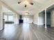 Expansive living room featuring beautiful hardwood floors, a cozy fireplace, and access to additional rooms at 238 Marks Rd, Mansfield, GA 30055