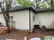Backyard exterior view with deck and lawn equipment provides a glimpse of outdoor space at 690 Mcdonough Se Blvd, Atlanta, GA 30315