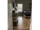 Bedroom featuring new wood flooring, gray walls, bed, dresser and a well-lit window at 690 Mcdonough Se Blvd, Atlanta, GA 30315