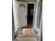 Entryway view with an open white front door and an interior with new wood flooring at 690 Mcdonough Se Blvd, Atlanta, GA 30315
