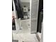This image looks through an unfinished room into the kitchen at 690 Mcdonough Se Blvd, Atlanta, GA 30315