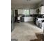 Spacious kitchen with stainless steel appliances and white cabinetry offers tons of potential at 690 Mcdonough Se Blvd, Atlanta, GA 30315