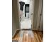Hallway view of laundry area with a stacked washer and dryer at 690 Mcdonough Se Blvd, Atlanta, GA 30315