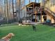 Backyard featuring a putting green, a deck, and a shaded patio with outdoor seating at 5930 Shannon Dr, Cumming, GA 30040