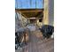 Outdoor deck with a covered lounge area, grill, and bar seating at 5930 Shannon Dr, Cumming, GA 30040