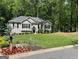 Beautiful single-story home with lush green lawn, flower beds, and a charming mailbox at 5930 Shannon Dr, Cumming, GA 30040