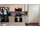 Well-equipped kitchen with stainless steel appliances and ample counter space at 5930 Shannon Dr, Cumming, GA 30040