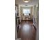 Well-lit kitchen with stainless steel appliances, light cabinets, and hardwood floors at 5930 Shannon Dr, Cumming, GA 30040