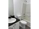 Full bathroom showcasing a toilet, vanity, and a shower over tub combination at 5041 Cottage Grove Pl, Union City, GA 30291