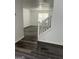 Welcoming entryway showcasing new flooring and staircase with white railings at 5041 Cottage Grove Pl, Union City, GA 30291