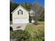 Inviting two-story home features a two-car garage and manicured front yard at 5041 Cottage Grove Pl, Union City, GA 30291