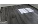 Close up of durable gray wood laminate flooring and natural light from the windows at 5041 Cottage Grove Pl, Union City, GA 30291