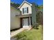Attractive home entrance with decorative stone accents and a well-manicured lawn at 5041 Cottage Grove Pl, Union City, GA 30291