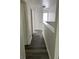 Upstairs hallway featuring modern gray wood floors, white doors and trim at 5041 Cottage Grove Pl, Union City, GA 30291