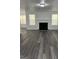 Spacious living room with a fireplace, hardwood floors, and natural lighting at 5041 Cottage Grove Pl, Union City, GA 30291