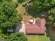Aerial view of the roof and back yard featuring a patio area with an umbrella at 1710 Crumbley Rd, Mcdonough, GA 30252