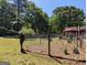 Backyard featuring garden and lawn with mature trees at 1710 Crumbley Rd, Mcdonough, GA 30252