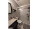 Well-lit bathroom features a glass enclosed shower, vanity and sink with stylish accessories at 1710 Crumbley Rd, Mcdonough, GA 30252
