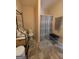Bathroom featuring tile floors, a shower, and decorative shelves at 1710 Crumbley Rd, Mcdonough, GA 30252