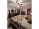 Bedroom with patterned bedding, dressers, and a round mirror at 1710 Crumbley Rd, Mcdonough, GA 30252