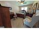 Bedroom features a ceiling fan, a bed with patterned comforter, and wooden furniture at 1710 Crumbley Rd, Mcdonough, GA 30252