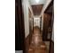 Hallway with wood floors and trim, and multiple doorways at 1710 Crumbley Rd, Mcdonough, GA 30252