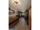 Bright kitchen with a wooden dining table, open shelving, and a black refrigerator at 1710 Crumbley Rd, Mcdonough, GA 30252