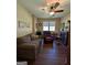 Living room with ceiling fan, wood floors, and comfortable seating at 1710 Crumbley Rd, Mcdonough, GA 30252