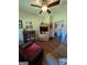 Living room featuring wood floors, comfortable seating and shelving at 1710 Crumbley Rd, Mcdonough, GA 30252
