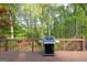 Large back deck featuring room for a grill, perfect for entertaining and overlooking a leafy landscape at 1270 Tribble Walk Ct, Lawrenceville, GA 30045
