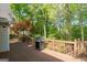 A view of the expansive outdoor deck, perfect for grilling, surrounded by lush greenery at 1270 Tribble Walk Ct, Lawrenceville, GA 30045