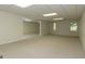 Finished basement with multiple rooms, carpet, and natural light from windows at 1270 Tribble Walk Ct, Lawrenceville, GA 30045