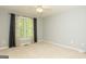 Spacious carpeted bedroom provides natural light through a lovely window at 1270 Tribble Walk Ct, Lawrenceville, GA 30045
