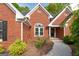 Close up of the front entrance highlighting the beautiful brickwork and manicured landscaping at 1270 Tribble Walk Ct, Lawrenceville, GA 30045
