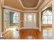 Elegant foyer featuring hardwood floors, detailed trim work, and a decorative front door with sidelights at 1270 Tribble Walk Ct, Lawrenceville, GA 30045