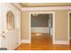 Spacious foyer with hardwood flooring, view into living space with wainscoting at 1270 Tribble Walk Ct, Lawrenceville, GA 30045