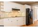 Kitchen with granite countertops, wood floors, stainless steel refrigerator and ample cabinet space at 1270 Tribble Walk Ct, Lawrenceville, GA 30045