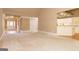 Large living room area with neutral carpet flooring adjacent to the entry way and kitchen at 1270 Tribble Walk Ct, Lawrenceville, GA 30045
