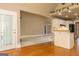 Open floor plan with hardwood floors, showcasing seamless flow from the kitchen to the carpeted living area at 1270 Tribble Walk Ct, Lawrenceville, GA 30045