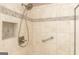 Stand-up shower features neutral tiling, a built-in niche, and a safety bar at 1270 Tribble Walk Ct, Lawrenceville, GA 30045