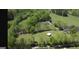Expansive property featuring a home with a pool, barn, and sprawling green pastures at 288 Trickum Creek Rd, Tyrone, GA 30290