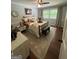 Cozy bedroom featuring hardwood floors, a ceiling fan, and natural light from the window at 288 Trickum Creek Rd, Tyrone, GA 30290